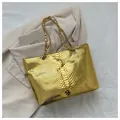 Golden snakeskin tote bag with metallic texture and elegant chain shoulder strap - Gold