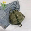 Mochila tipo cubo de nailon verde militar con cordón y bolsillos dobles con hebillas - Verde