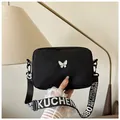 Minimalist black nylon square crossbody bag with white butterfly logo and wide strap - Black