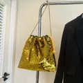Chic golden sequin bucket bag with drawstring and metal chain shoulder strap - Gold