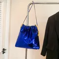 Royal blue sequin bucket bag featuring a bright yellow drawstring and metal chain strap - Blue