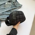 Black padded quilted nylon crossbody bag with adjustable wide shoulder strap and soft texture - Black