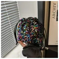 Close-up of colorful sequin bucket bag with drawstring closure and fine texture - Colorful