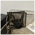 Detail of transparent black PVC tote bag with cartoon pattern and long shoulder straps - Transparent Black