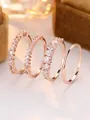Close-up of four-piece rose gold ring set with cubic zirconia on brown velvet - Rose Gold (White Zirconia)