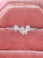 Macro shot of silver bow ring with sparkling zircons in a pink velvet jewelry box - US 6 / White Gold With White Zirconia