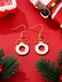 Detail view of Christmas wreath drop earrings with red bow and white enamel dots - White Wreath