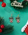 Detail view of cute reindeer earrings with red nose on a festive green background - Cartoon Elk