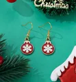 Close-up of red and gold Christmas ball earrings with 3D snowflake on pine branch - Snowflake Bauble