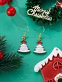 Detail of white Christmas tree earrings with gold dots and red stars on green festive background - White Christmas Tree
