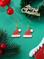 Detailed close-up of festive red Christmas hat earrings with gold stars and white trim - Red Christmas Hat