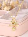 Close-up of gold Christmas tree pendant with sparkling zircon stones and a drop crystal - Gold Full Zircon Christmas Tree