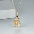 Detailed close-up of a golden Santa Claus pendant with micro-pave white cubic zirconia - Two-Tone White Zircon Santa