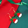 Festive red and white Christmas bell earrings with green bows and golden hooks - Christmas Bell