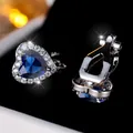 Blauwe hart-zirkonia clip-on oorbellen met zilveren zetting en halo-kristallen - Hart Oorklem / Blauwe Zirkonia