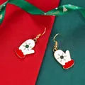 Christmas glove earrings with green snowflake pattern and gold hooks on festive background - Christmas Mittens