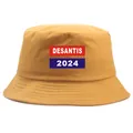 Κίτρινο DeSantis 2024 καπέλο κουβάς με μπλε και κόκκινο προεκλογικό τύπωμα - Ενιαίο μέγεθος ενηλίκων (58cm μη ρυθμιζόμενο) / Κίτρινο τζίντζερ