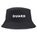 Black cotton bucket hat with white GUARD lettering print shown on a plain white background - One Size / Black (White Logo)