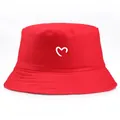 Vibrant red cotton bucket hat featuring a white hand-drawn heart print for casual sun protection - Adult One Size (58cm Non-adjustable) / Red