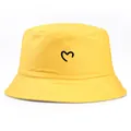 Bright yellow cotton bucket hat featuring a black hand-drawn heart embroidery on the front - Adult One Size (58cm Non-adjustable) / Yellow