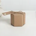 Hexagon kraft paper gift box with rustic twine tie and hollow heart tag on white background - Hexagon Style / Brown