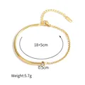 Detail view of gold titanium steel chain bracelet with zircon and 18+5cm size label - Round Zirconia Adjustable Style (B998-02)