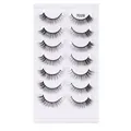 7 pairs of 7028 wispy synthetic eyelashes with natural volume on a white tray - Thick Curly Style (7028)