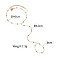 Detailed view of gold slave chain with beaded links and dimension callouts - Ring-Linked Bracelet (1095-A) / Gold