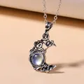 Vintage bohemian crescent moon necklace featuring an iridescent stone pendant in silver finish - Moonstone Pendant Necklace