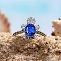 Exquisite turtle ring featuring a blue gemstone and white zircon on a beach sand setting - Royal Blue Rhinestone