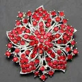 Elegant floral wreath brooch featuring shimmering red crystals on silver finish metal - Red