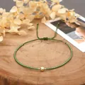 Detail of bohemian green hand-woven bead anklet with adjustable gold-tone center bead - Green Rope/Gold Cut Bead/Green Seed Bead(MI-B210046A)