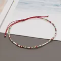 Macro shot of colorful seed beads on adjustable red woven bohemian lucky bracelet - Red Rope/Colorful Seed Bead(BR0129)