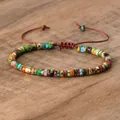 Adjustable woven bracelet with colorful 4mm natural emperor stone beads on wood surface - No.49 Multicolor Imperial