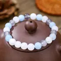 Detail of beaded bracelet with blue, white and purple stones on a ceramic pot lid - Blue White Gray Natural Stone Style (ZJ13502)