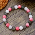 Pink strawberry quartz and grey labradorite beaded bracelet on a wood background - Pink White Gray Natural Stone Style (ZJ13501)