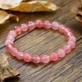 Bracciale elastico fatto a mano con perle in quarzo fragola su legno scuro - Stile Zen Quarzo Fragola Rosa (ZJ13505)