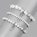 Detail view of white natural stone bead bracelets with star, moon and wing pendants - White (FK1306-19CM)