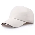 Cremefarbene 5-Panel Baumwoll-Baseballkappe mit gebogenem Schirm und schwarzer Paspel - Beige