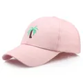 Pink cotton baseball cap with green palm tree embroidery and curved brim in side view - Adjustable / Pink
