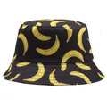 Reversible bucket hat featuring yellow banana print on black cotton fabric for street style - M (56-58cm) / Black