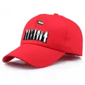 Red Dubai cotton baseball cap with UAE flag and traditional figure embroidery design - Red