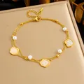 Detail of double-layer gold chain anklet featuring starfish pearl and shell charms - Irregular Shell Style (B1573)