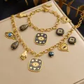 Gold plated stainless steel evil eye and hamsa charm necklace and bracelet jewelry set - B2077+N4137 2-Piece Set