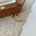 Bague élégante en argent S925 doré avec anneau tressé et pierre précieuse verte - Ouvert réglable / Zirconia Vert Doré