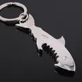 Polished silver shark-shaped metal bottle opener keychain with a sleek mirror finish - Silver Shark Style