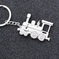 Gepolijste metalen stoomlocomotief sleutelhanger op een luxe zwarte getextureerde basis - Helder Zilver Stoomtreinkop
