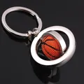 Rotating basketball keychain made of silver alloy and textured orange rubber with black mirror reflection - Rotating Basketball Style (GX-072)