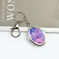 Portable mini oval makeup mirror keychain featuring an elegant purple butterfly design - Oval Purple Butterfly (With Lobster Clasp)