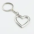 Polished silver hollow heart keychain with metallic ring and chain on white background - Heart Hollow / 39*40*3mm / Silver